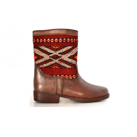 Leather boot and kilim