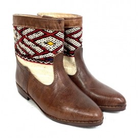 Leather boot and kilim